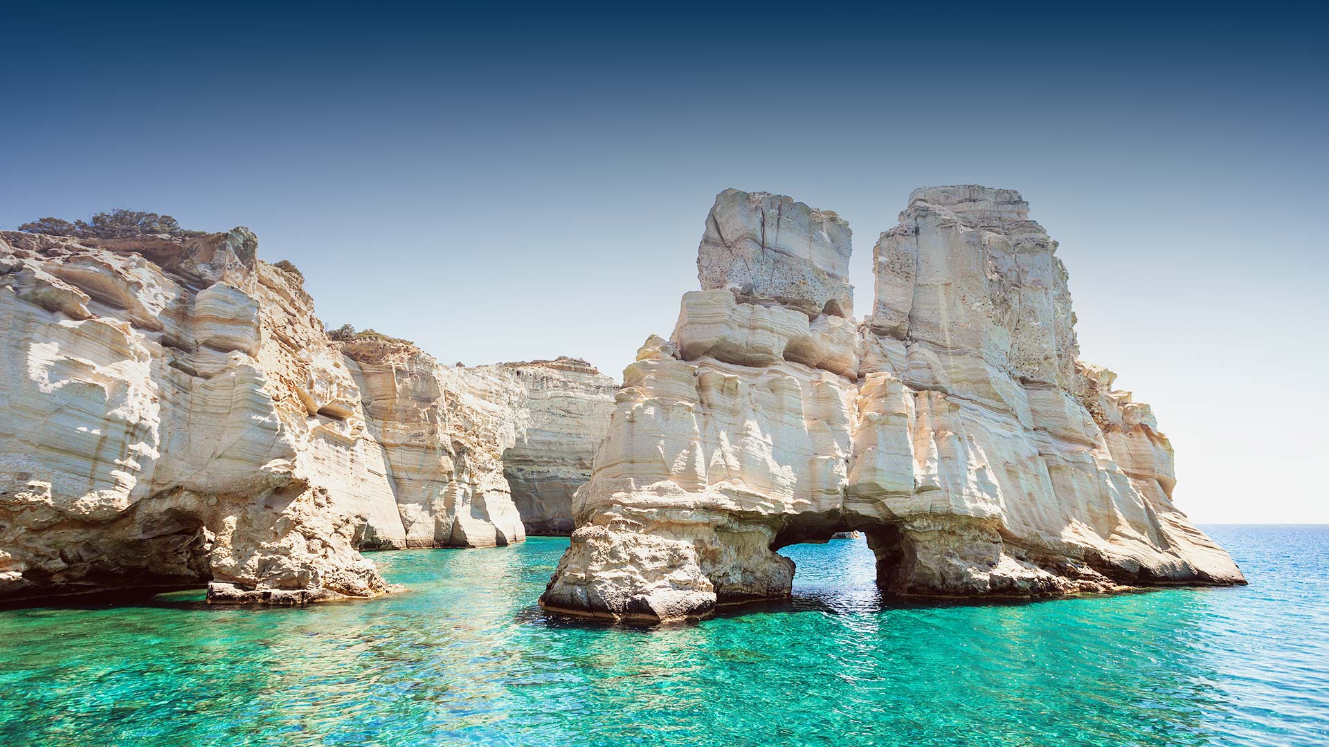 Discover the Tranquil Beauty of Milos Island - ODYSSEY ROCK SUNSET SUITES